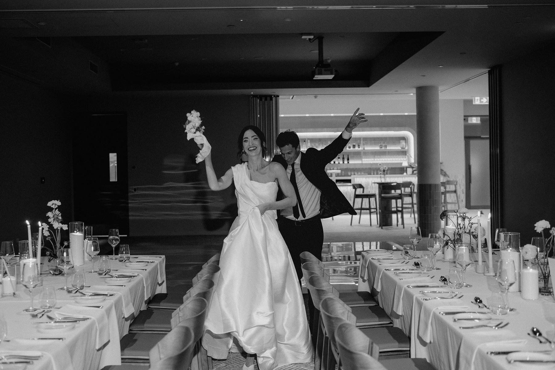 A bride and groom making their entrance into the Avani Ballroom