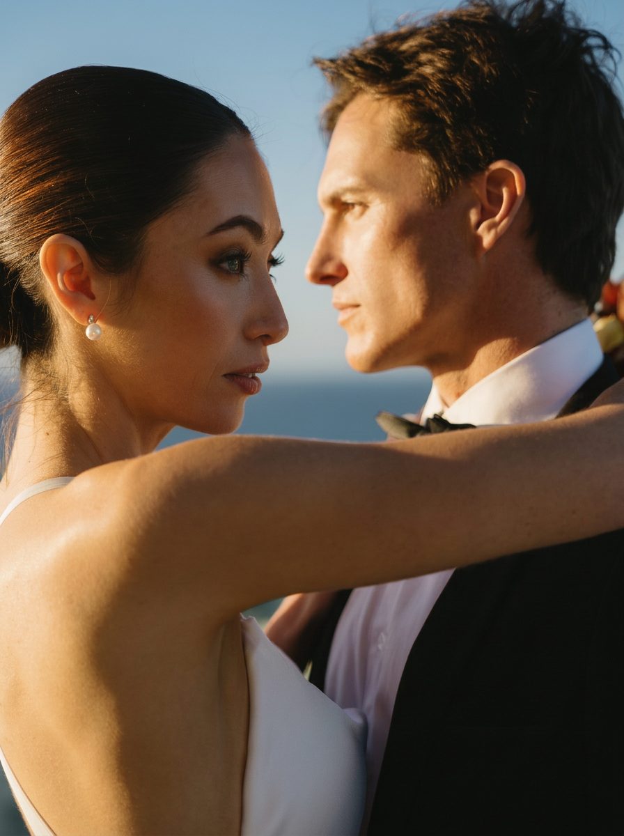 A couple close together on the rooftop in the evening light
